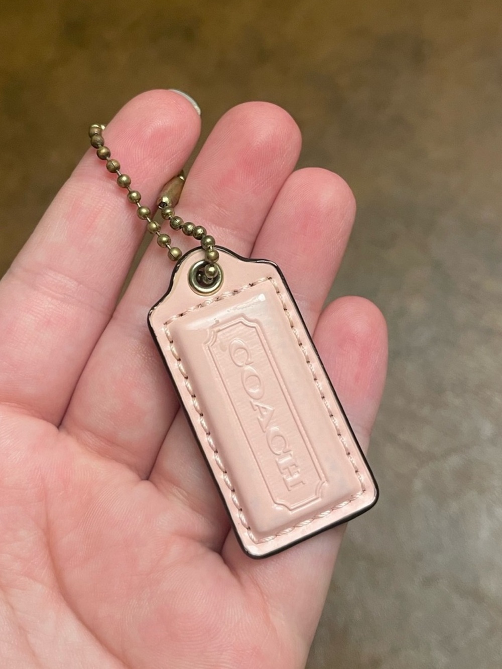 Pink coach hang tag